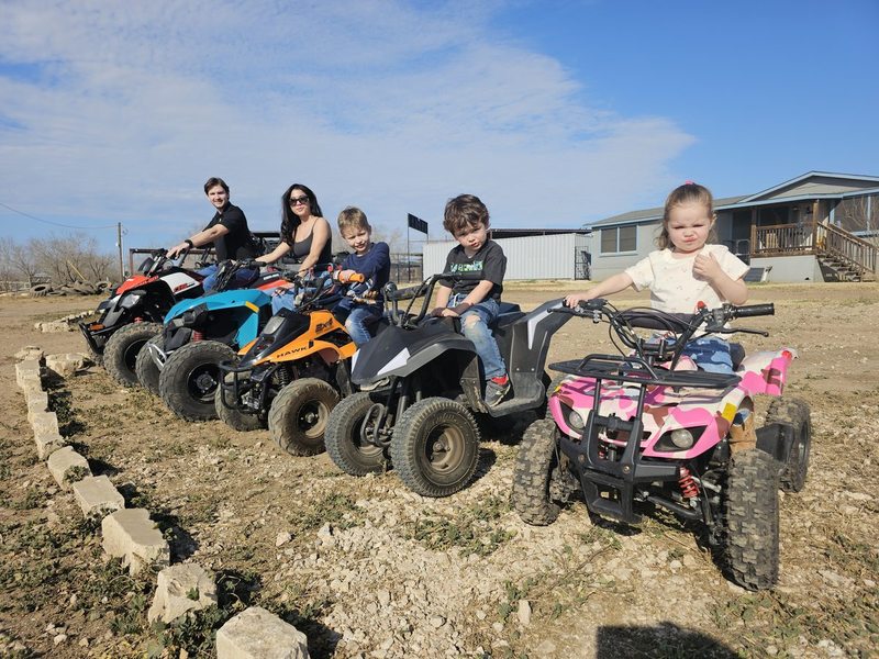 Family riding ATVs at 281 Country Club — kids and adults welcome